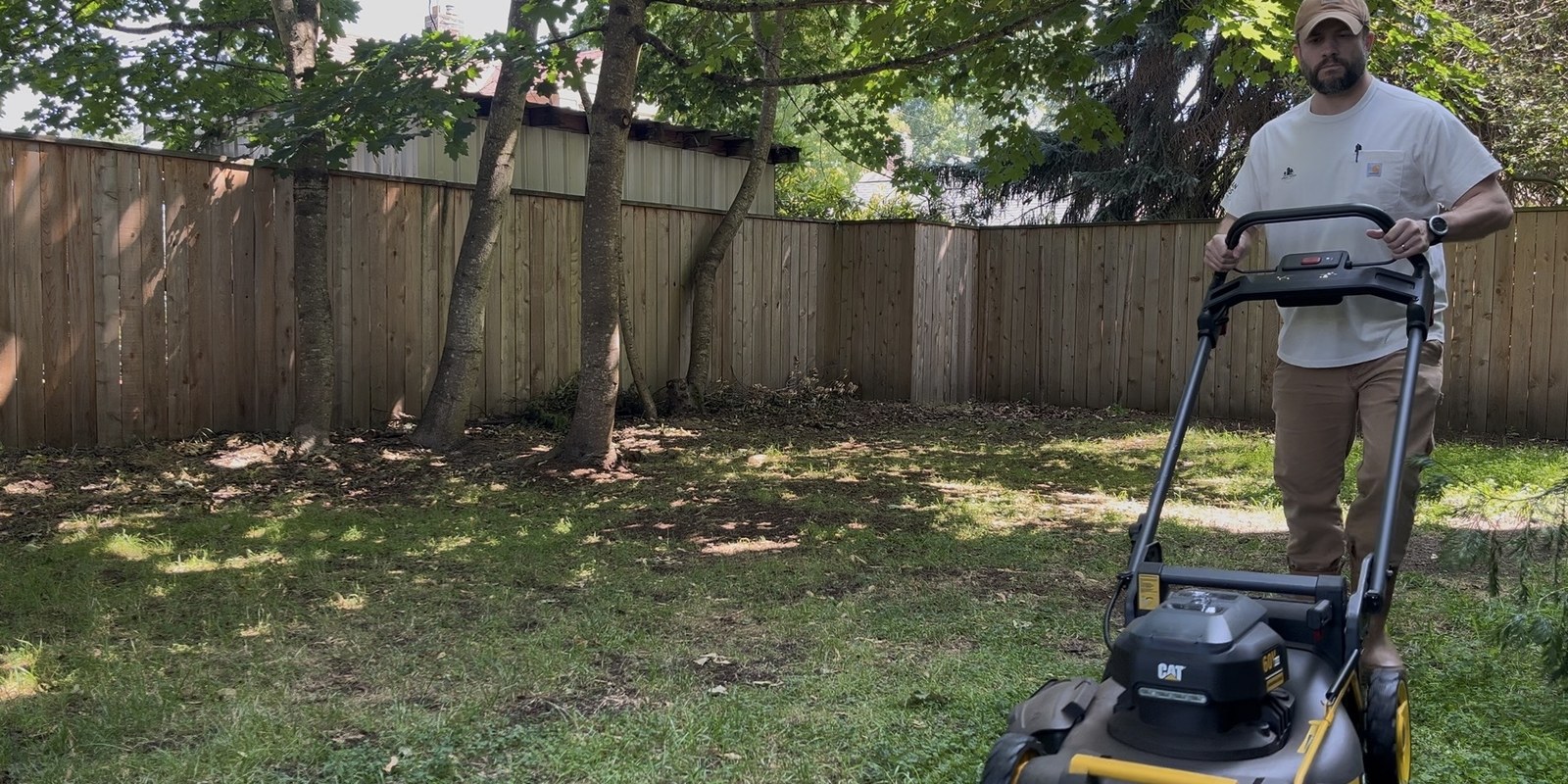 Urban Yards groundskeeping lawn care with electric mower.